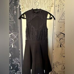 Black dress with sheer lacy top, high neck short sleeve.